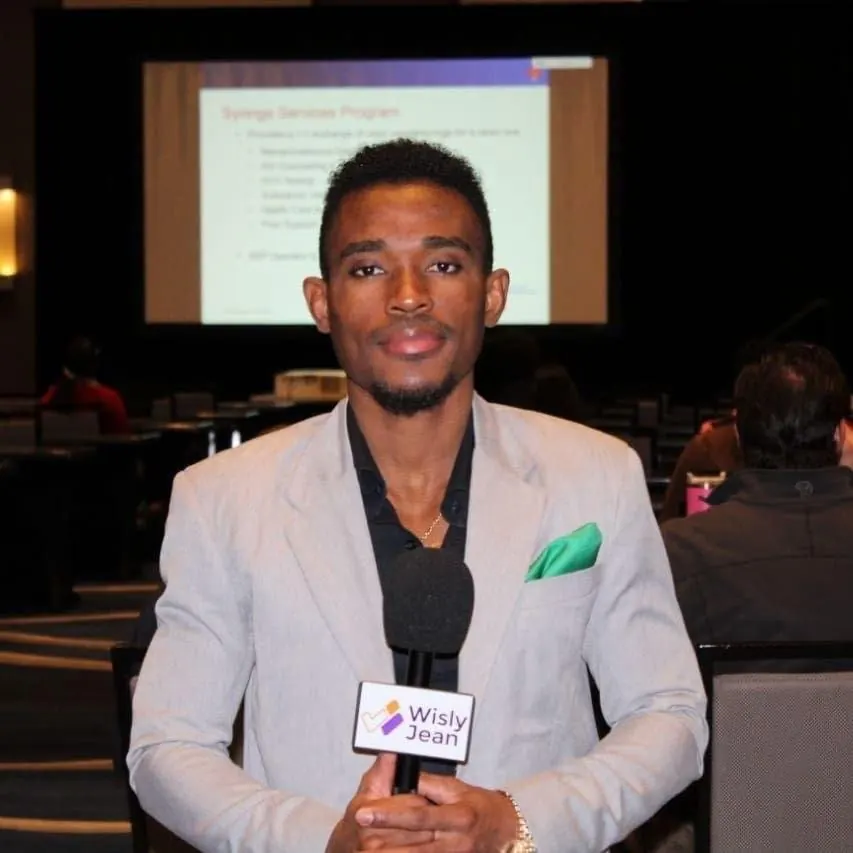 Journalist in a suit holding a microphone